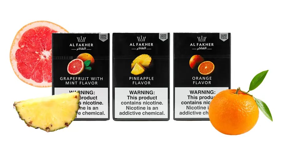 Al Fakher Grapefruit Mint, Pineapple, and Orange 50g boxes with slice of grapefruit, pineapple, and orange