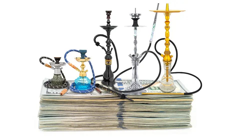 Various hookah pipes on stack of dollar bills