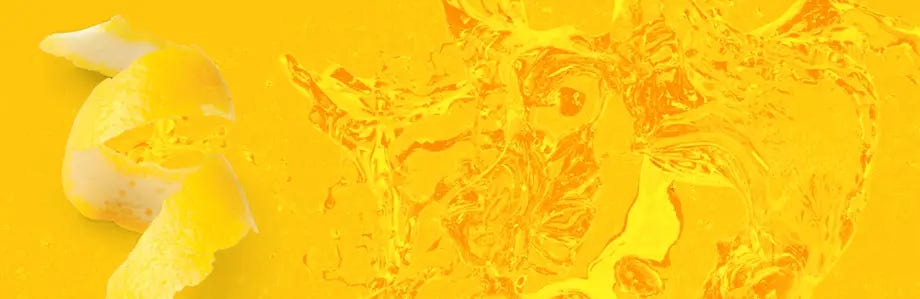 Close up of fruit juice with lemon peel