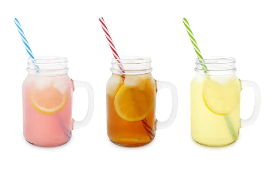 Pink lemonade, peach lemonade and limeade in glasses