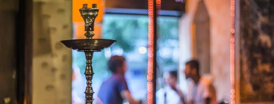 Smoking hookah in a hookah lounge setting