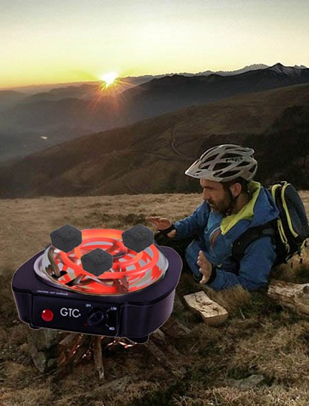 Cold weather hiker hovered around hookah charcoal burner